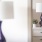 a lamp and a vase of flowers
