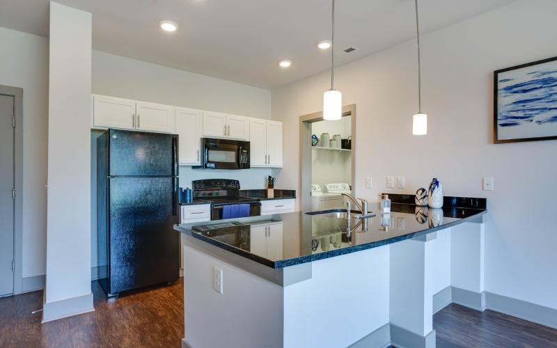 a kitchen with white cabinets