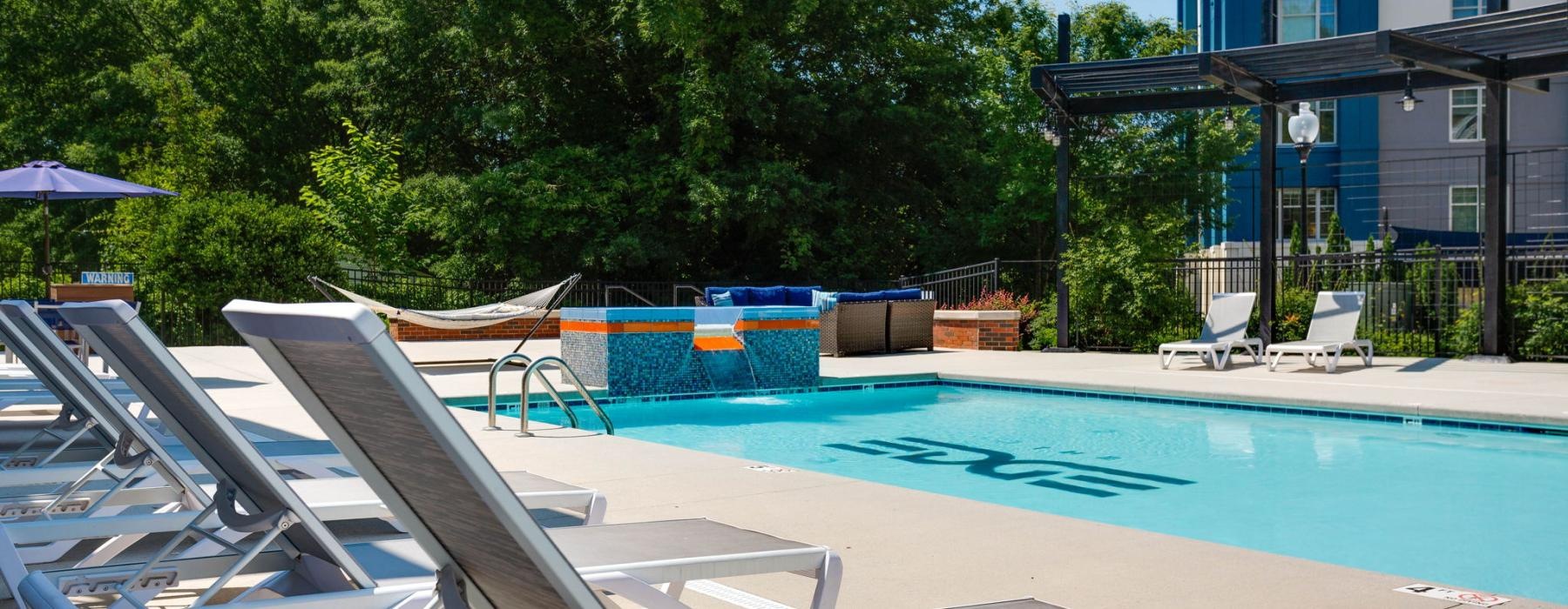 a pool with chairs around it