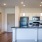 a kitchen with a bar and a table