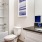 a bathroom with a tub sink and toilet
